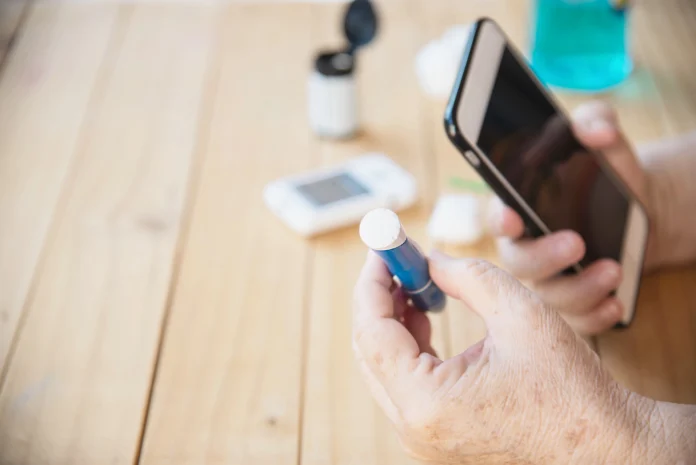 old-lady-is-testing-blood-sugar-level-using-blood-sugar-test-kid-set Diabetes